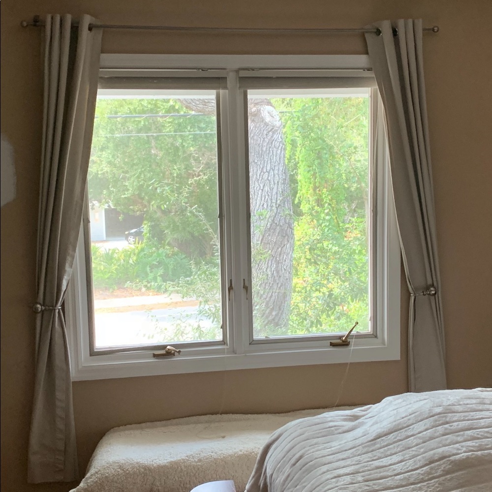 One set of tan/beige curtains